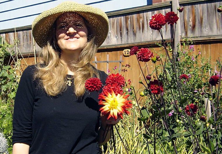 Barbara Raynor posing in garden.