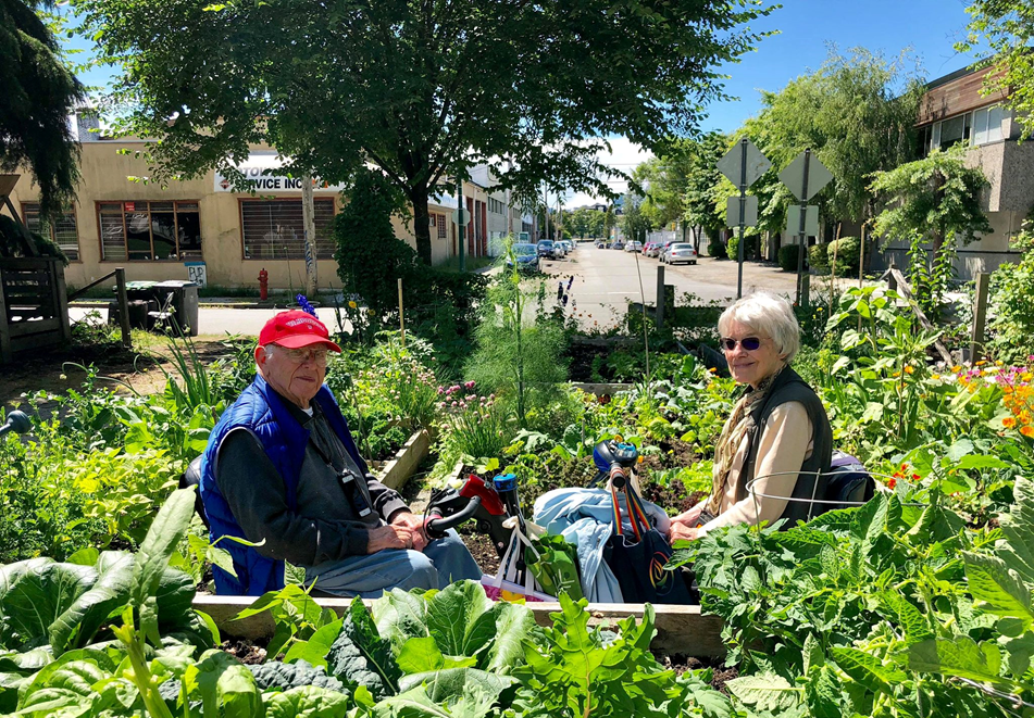 Jack Tait and Jean Donaldson posing in one of DIGA's gardens.