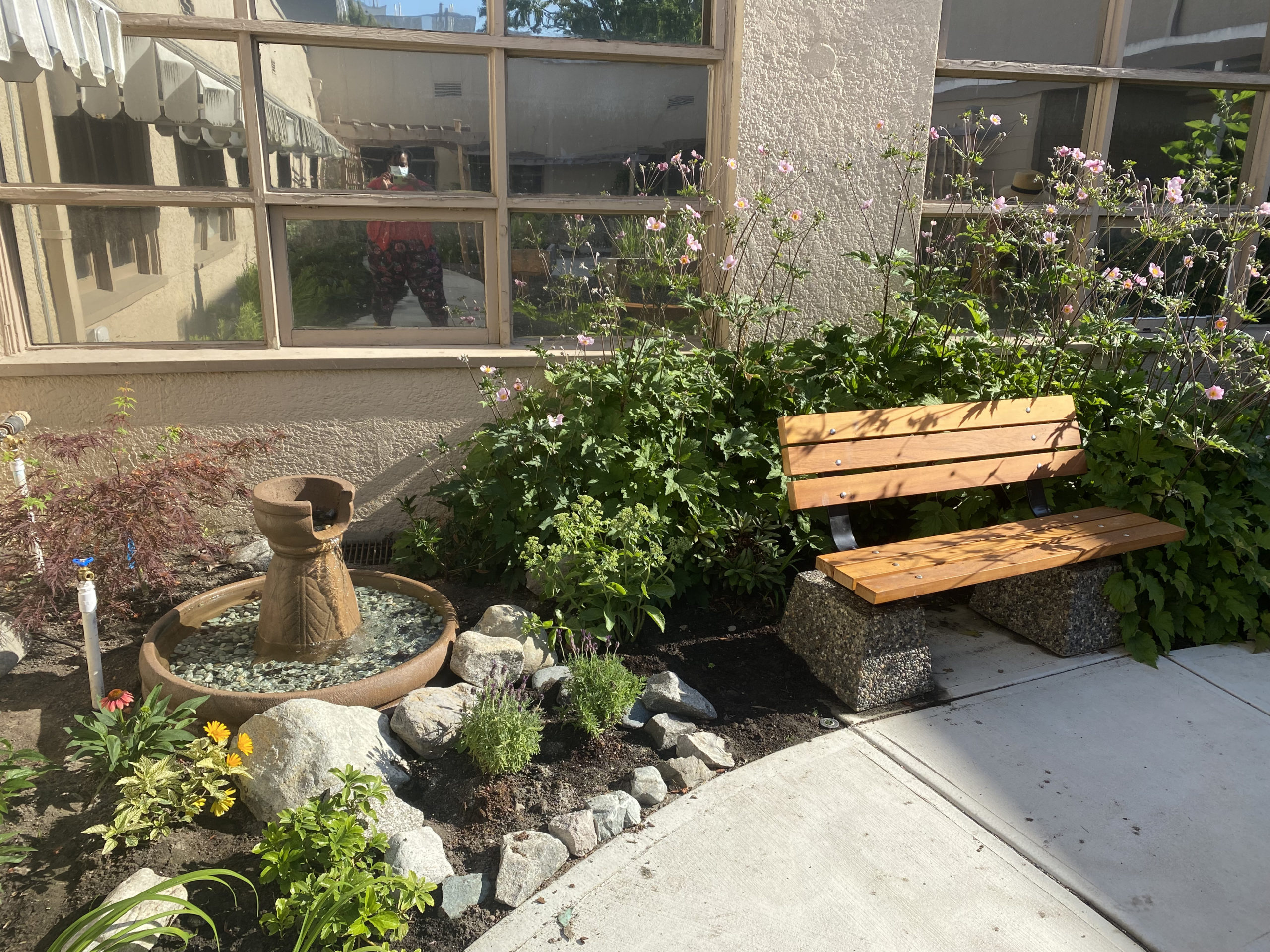 GF strong Community Garden bench and fountain.